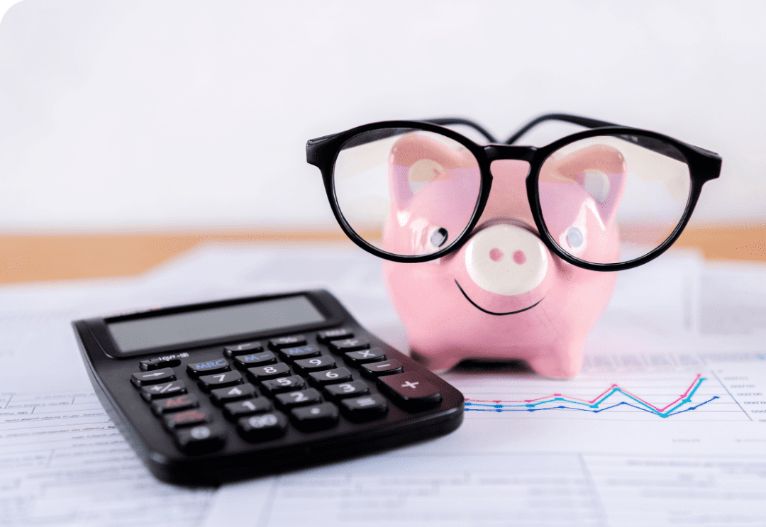 BAS Piggy bank wearing glasses with a calculator and financial charts in the background.